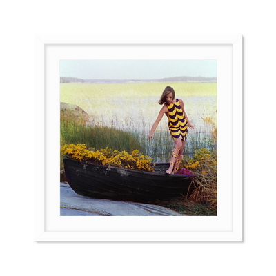 Model In Rowboat Filled With Yellow Flowers Постер
