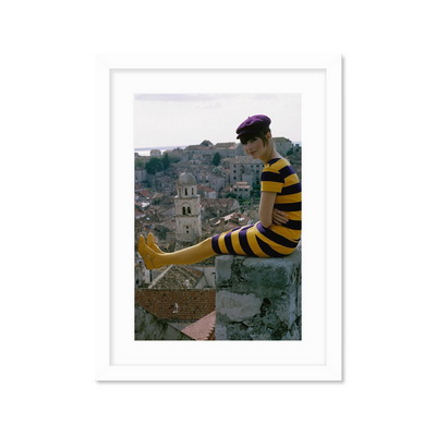 A Woman Sitting On A Stone Wall Постер A Woman Sitting On A Stone Wall Постер
