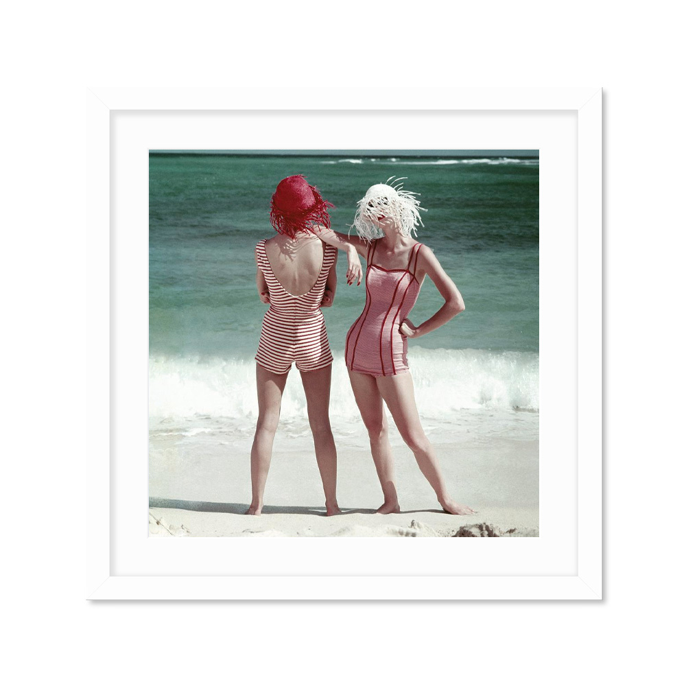 

Two Models Standing On A Beach Постер